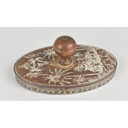 25 - A 19th Century Colonial Oval Press/Stamp with Intricate White Metal Inlay Detailing Hut Scene with P... 