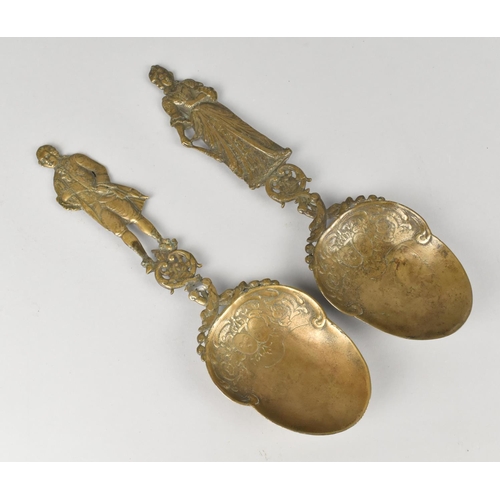 27 - A Pair of Late 19th/Early 20th Century Ornate Cast Bronze Serving Spoons having Figural Handles in t... 