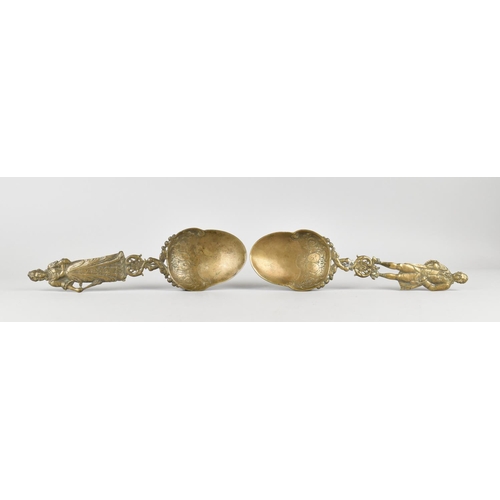 27 - A Pair of Late 19th/Early 20th Century Ornate Cast Bronze Serving Spoons having Figural Handles in t... 