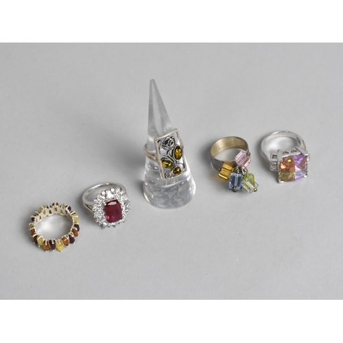 311 - A Collection of Five Various Silver rings to include Two Amber Mounted Examples and Three Jewelled E... 