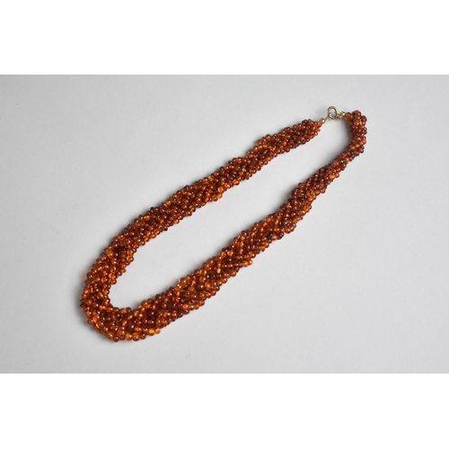 314 - An Amber Bead Multistrand Necklace, Plaited Form, 45cms Long