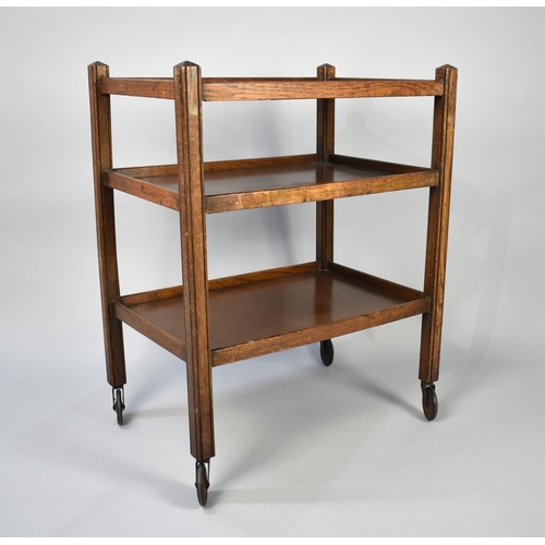 36 - An Early 20th Century Oak Three Tier Trolley on Caster Supports, 63x40x27cms High