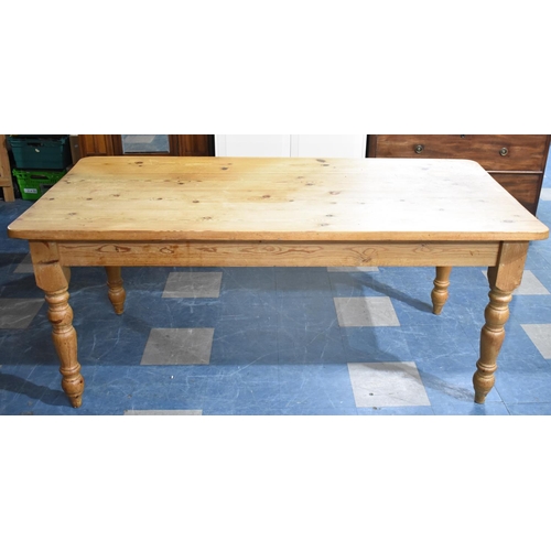 404 - A Pine Four Plank Kitchen Table, 181x89x79cms high