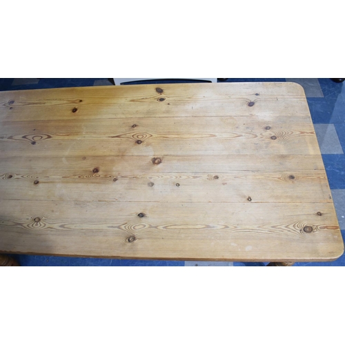 404 - A Pine Four Plank Kitchen Table, 181x89x79cms high