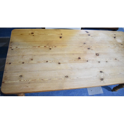 404 - A Pine Four Plank Kitchen Table, 181x89x79cms high