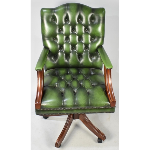 431 - A 20th Century Green Leather Button Back Captains Office Chair on Castor Supports