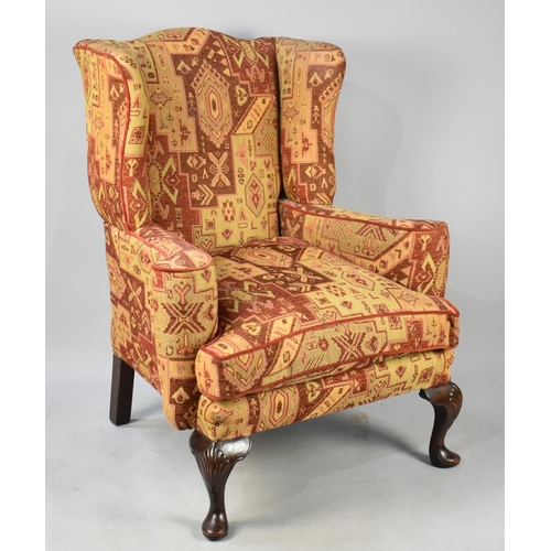 432 - An Upholstered Wingback Armchair