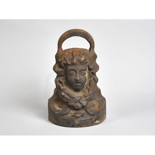 54 - A Cast Metal Doorstop Modelled with Maidens Head, 20cms High