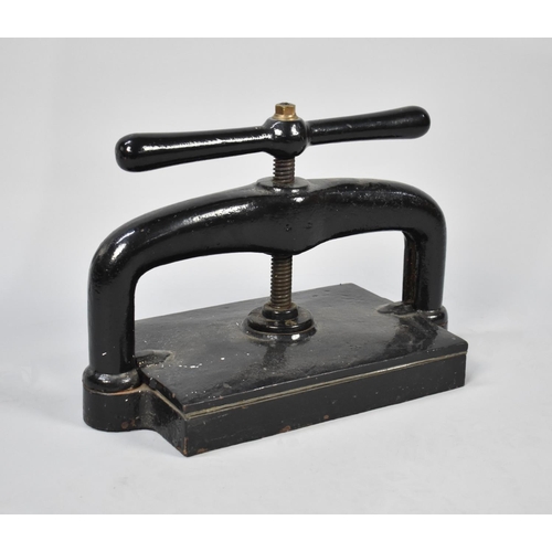 7 - A Victorian Black Painted Cast Iron Book Press, 47cms Wide and 33cms High