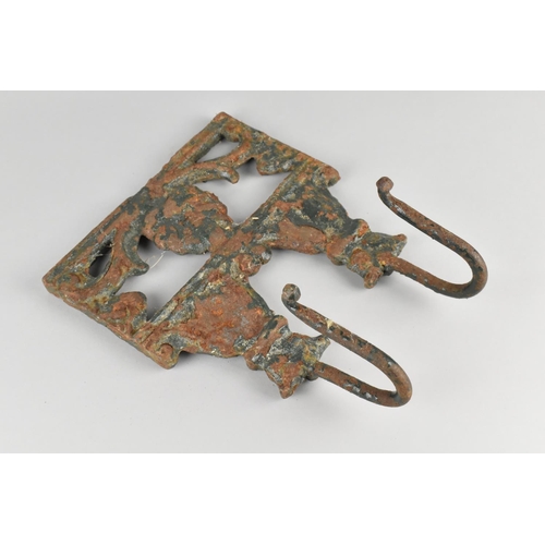 136 - A 19th Century Green Painted Cast Iron Double Hook Rest, 20cms Wide and 25.5cms High