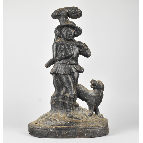 18 - A Heavy 19th Century Cast Iron Door Porter in the Form of Woodman with Dog, 38cms High