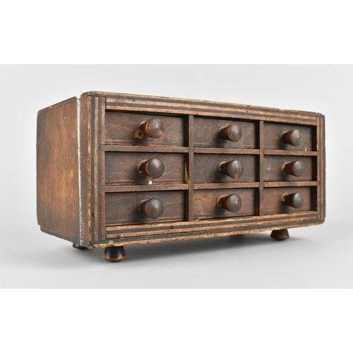 2 - A Small Table Top Engineers or Collectors Chest of Nine Small Drawers with Wooden Handles, 19.5cms W... 