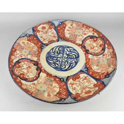 249 - A Large Japanese Meiji Period Charger Decorated with Central Blue Floral Motif Bordered by Various P... 