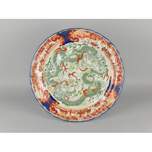 250 - A Japanese Porcelain Imari Charger with Scalloped Edge Decorated with Green Dragons and Bordered by ... 