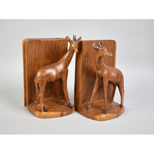 51 - A Pair of Carved African Wooden Bookends with Giraffes, 16cms High