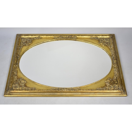 528 - A Modern Gilt Framed Wall Mirror with Oval Glass, 76x106cms