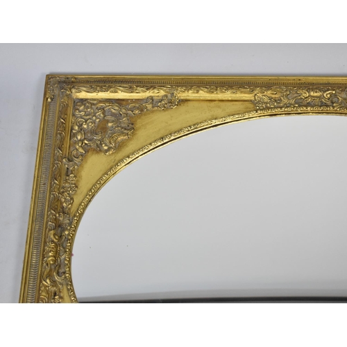 528 - A Modern Gilt Framed Wall Mirror with Oval Glass, 76x106cms