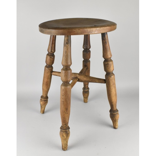 76 - A Vintage Oval Seated Four Legged Stool, 35cms Wide and 51cms High