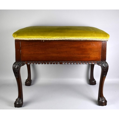 79 - A Mahogany Upholstered Box Stool with Claw and Ball Feet, 69cms by 45cms and 55cm high