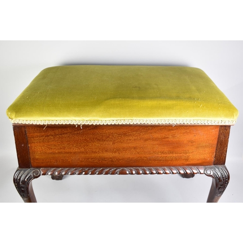 79 - A Mahogany Upholstered Box Stool with Claw and Ball Feet, 69cms by 45cms and 55cm high