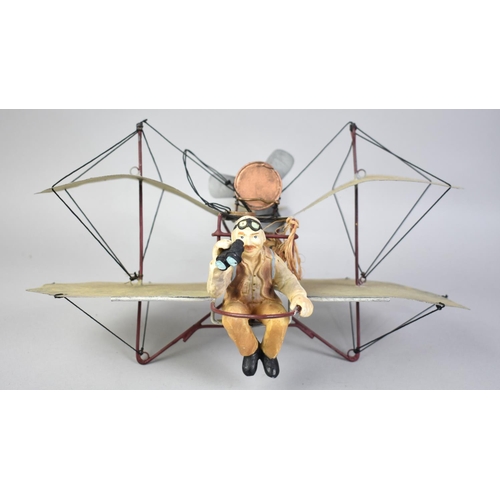 115 - A Modern Tin Plate Ceiling Hanging Model of a Pilot in Early Bi-Plane, 29cms Long