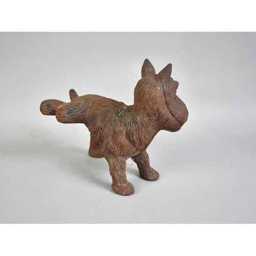 119 - A Late 19th/Early 20th Century Cast Iron Door Stop in the Form of a Terrier with Cocked Leg, 23cms L... 