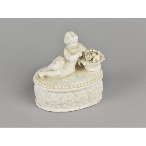 16 - A 19th Century Derby Creamware Oval Box, The Lid with Reclining Girl Beside Basket of Flowers, Body ... 