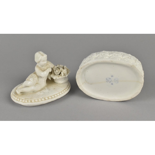 16 - A 19th Century Derby Creamware Oval Box, The Lid with Reclining Girl Beside Basket of Flowers, Body ... 