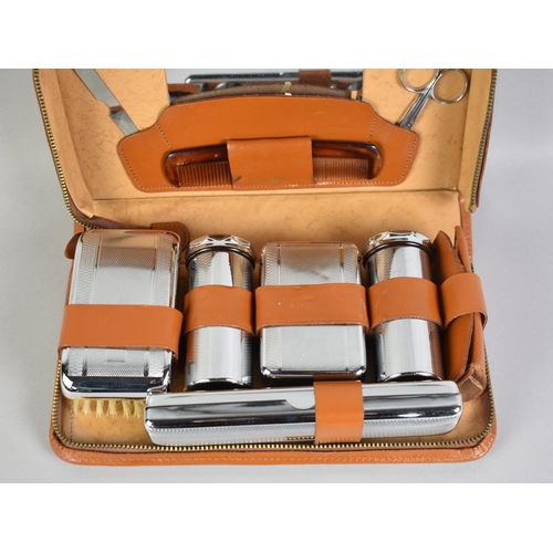 166 - A Collection of Various Leather Cased Travelling Sets, Cased Medicine Glass, Cased Razor, Arm Bands ... 