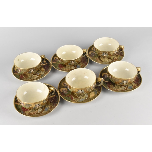 276 - A Japanese Satsuma Tea Set Comprising Six Cups and Saucers Decorated with Figures and Enriched with ... 