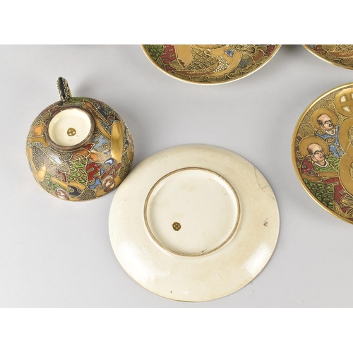 276 - A Japanese Satsuma Tea Set Comprising Six Cups and Saucers Decorated with Figures and Enriched with ... 