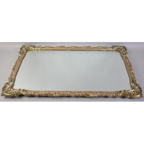 321 - An Ornate Framed Mirror, 68x45cm