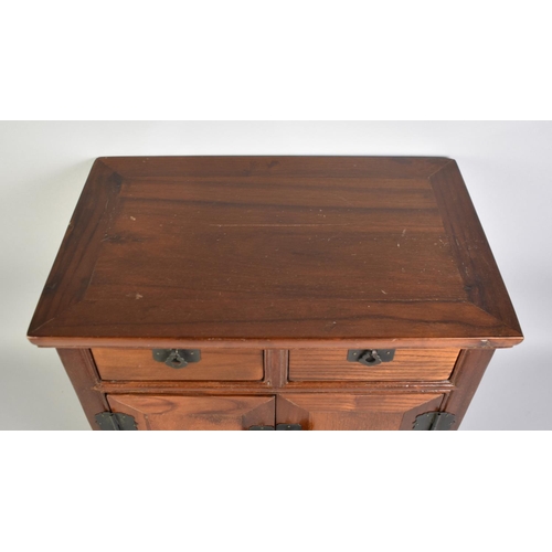 35 - A 20th Century Stained Wooden Oriental Table Top Collectors Cabinet with Two Short Drawers Over Cupb... 