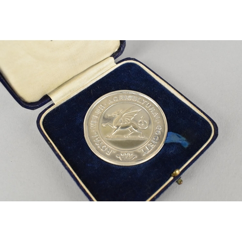 403 - A Silver Medallion by Mappin & Webb for The Royal Welsh Agricultural Society, Presented to S.H. Broo... 