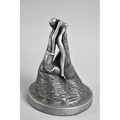 48 - An Aluminium Effect Resin Erotic Sculpture of Nude Held Between Thumb and Forefinger, 17cms High