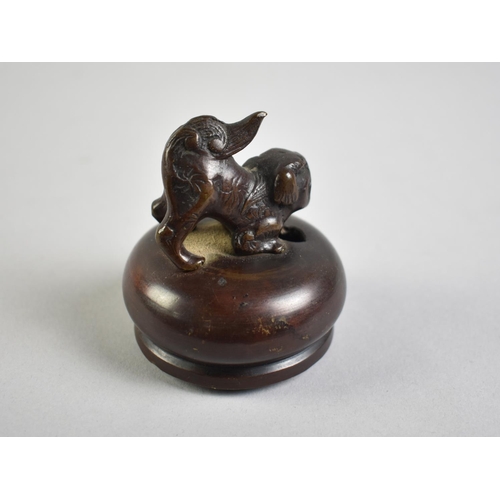 50 - A Patinated Bronze Oriental Vase Lid with Temple Dog Finial, 6cms Diameter