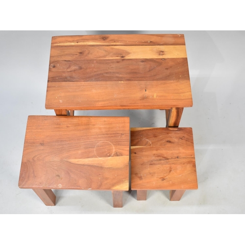 525 - A Nest of Three Far Eastern Hardwood Tables, 49cms Wide