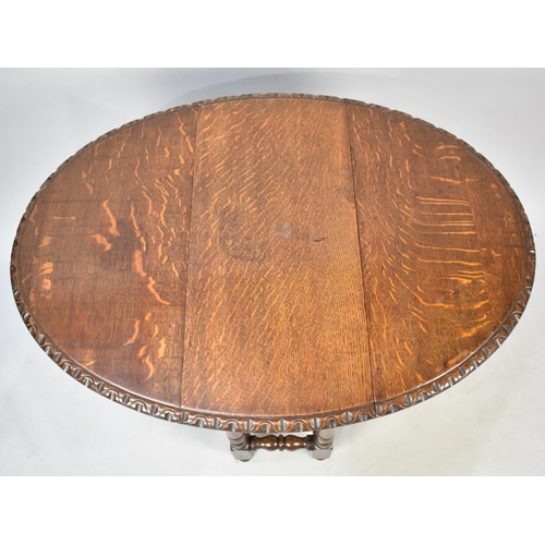 534 - A Mid 20th Century Oak Drop Leaf Gate Leg Oval Topped Occasional Table, 66cms Long and 65cms High