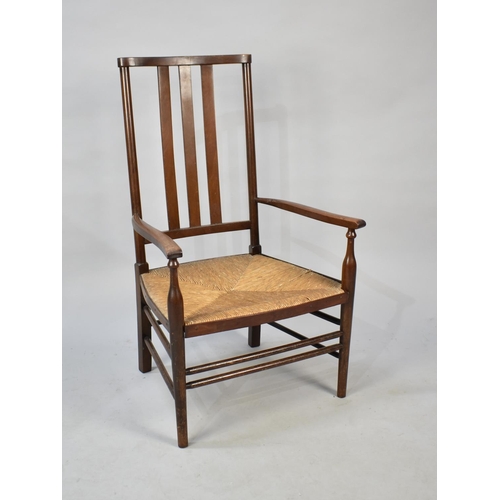 565 - An Edwardian Mahogany Framed Rush Seated Ladies Nursing Armchair