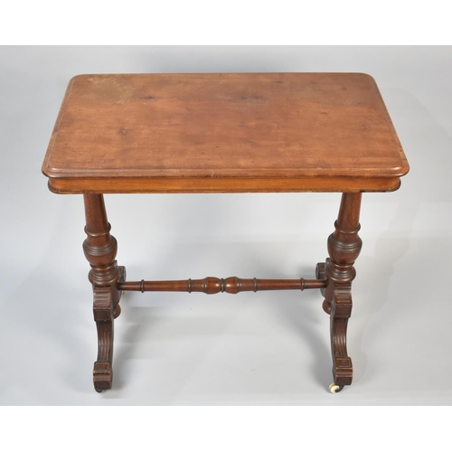 59 - A Late Victorian Mahogany Rectangular Side Table with Turned Supports and Castors, 76cms Wide