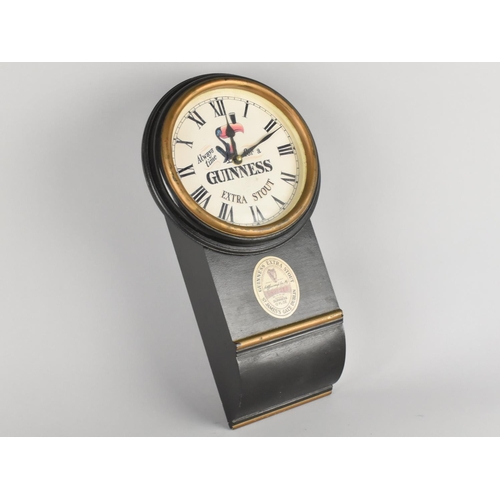 101 - A Reproduction Wall Hanging Advertising Clock for Guinness, Battery Movement, 41cms High