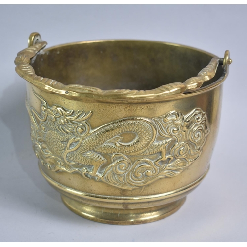 106 - A Polished Brass Chinese Bucket with Loop Carrying handle, Body Decoration in Relief with Dragon, 19... 