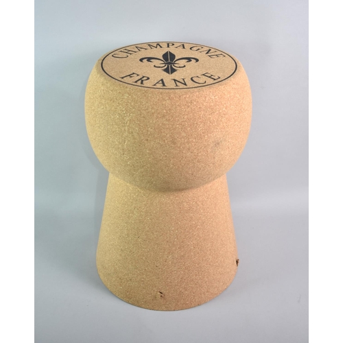 111 - A Novelty Stool in the Form of a Champagne Cork, 35cms Diameter and 50cms High