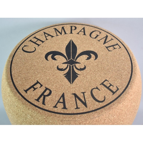 111 - A Novelty Stool in the Form of a Champagne Cork, 35cms Diameter and 50cms High