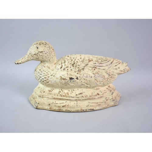 122 - A Modern White Painted Cast Metal Doorstop in the Form of a Duck, 27cms Long