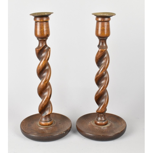 125 - A Pair of Edwardian Oak Barley Twist Candlesticks, 30cms HIgh