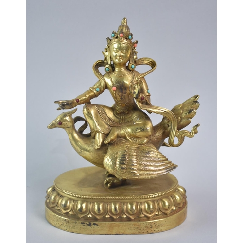 130 - A Gilt Bronze Study of Tibetan Deity, Sat on Bird, Oval Lotus Throne Base, Jewelled Mounts, 24cms Hi... 