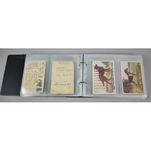 135 - A Ringbinder Containing Nine WWI silk Postcards, Nestle's Swiss Milk Advertising Postcards, Spillers... 