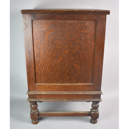 57 - An Edwardian Oak Chest of Three Short Drawers, 34cms Wide and 74cms High, Brass Drop Handles