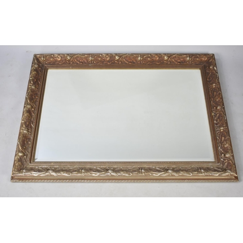 580 - A Modern Gilt Framed Wall Mirror, 107x79cms